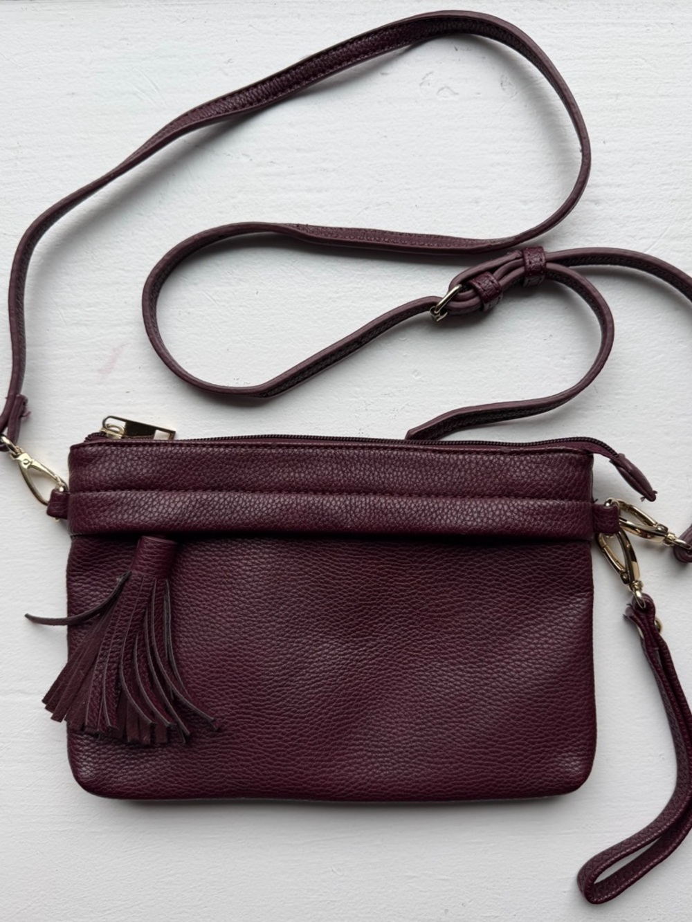 Sole Society Burgundy Pebbled Leather Tassel Wristlet Approx. 6” x 8”. Well made
